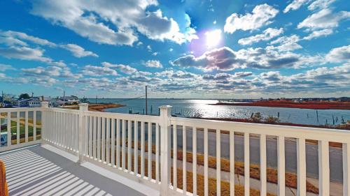 a balcony with a view of the water at West Atlantic City Bayview House in Pleasantville