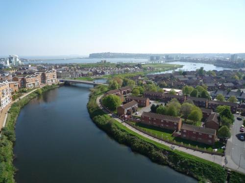 an aerial view of a river in a city at Century Wharf Apartments by Urban Space in Cardiff