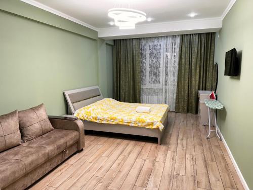 Una cama o camas en una habitación de Vavilon