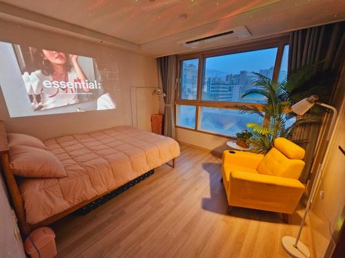 a bedroom with a bed and a large window at Incheon City Hall Station Full Option Lovely House in Incheon