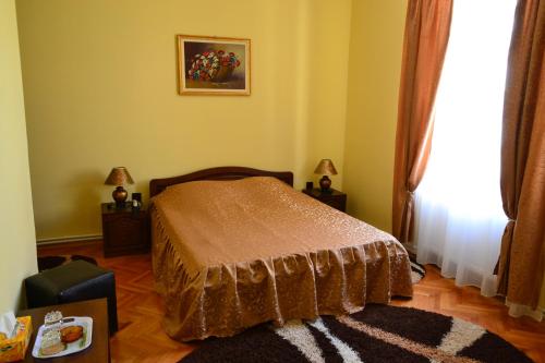 Ένα ή περισσότερα κρεβάτια σε δωμάτιο στο Porto Franco Residence