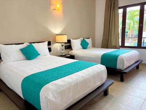 Hotel Aria Quinta Avenida & Rooftop Playa del Carmenにあるベッド