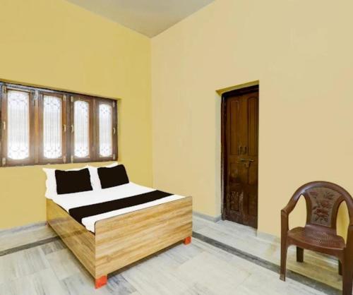 Postel nebo postele na pokoji v ubytování Vinayak Home Stay Ganganagar