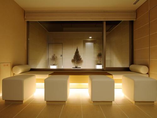 a waiting room with two chairs and a table at Mitsui Garden Hotel Sapporo in Sapporo