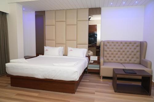 Postel nebo postele na pokoji v ubytování Hotel Grand Sigma
