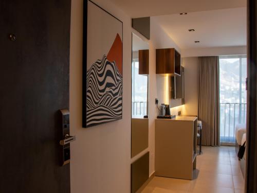 a door to a room with a view of a kitchen at Coral Beach Hotel & Spa in Aqaba