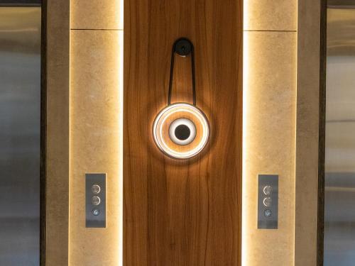 a close up of a wooden door with a knob at Coral Beach Hotel & Spa in Aqaba