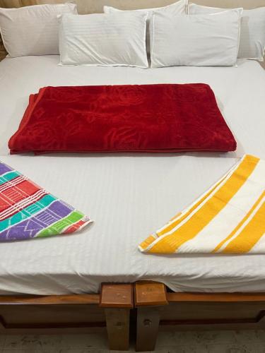 Postel nebo postele na pokoji v ubytování VARIYATH HOMESTAY THIRUNELLi