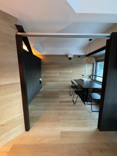 a room with a table and a dining room at Suite 1400 in Marilleva