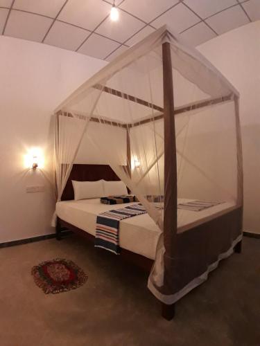 Postel nebo postele na pokoji v ubytování Cashew Villa Hiriketiya