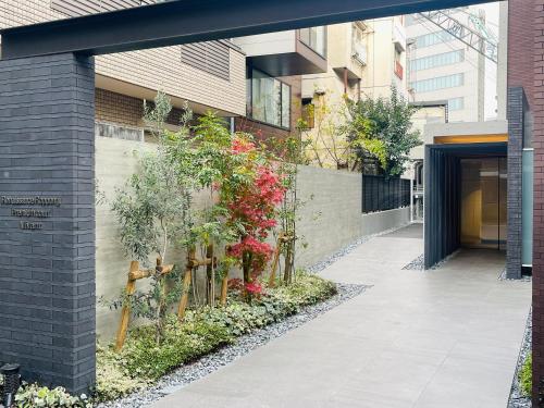 a building with plants on the side of it at Alo BnB 9 - Near ROPPONGI, GINZA, SHINJUKU, SHIBUYA - Self check-in in Tokyo