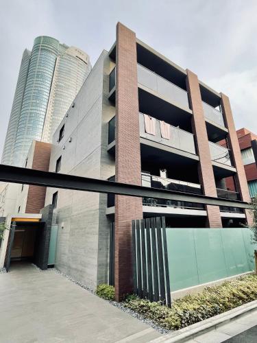 a building with two tall buildings in the background at Alo BnB 9 - Near ROPPONGI, GINZA, SHINJUKU, SHIBUYA - Self check-in in Tokyo