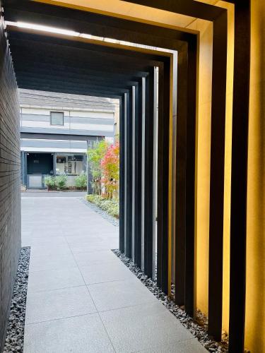 a hallway leading into a building with at Alo BnB 9 - Near ROPPONGI, GINZA, SHINJUKU, SHIBUYA - Self check-in in Tokyo