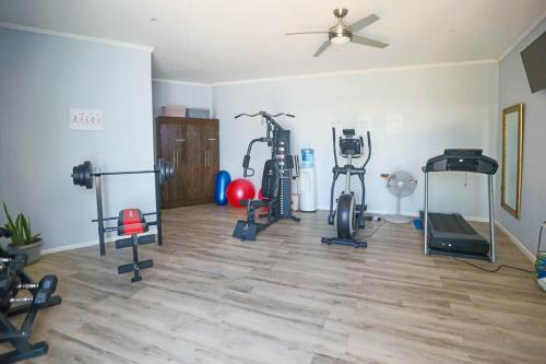 a gym with several exercise equipment in a room at One Rodney Heights Condominiums in Gros Islet