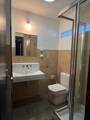 a bathroom with a sink and a toilet at Casa Rural Aracena Bliss in Aracena