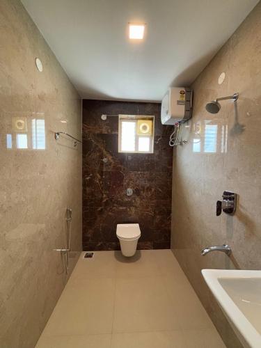 Ένα μπάνιο στο Srirangam Nandavanam service Apartments
