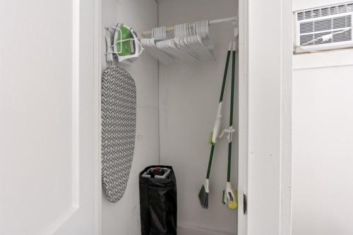 a closet with a bunch of umbrellas in it at Leech Lake Views Quaint Stay Near Town & Hiking in Walker