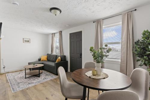 a living room with a table and a couch at Leech Lake Views Quaint Stay Near Town & Hiking in Walker