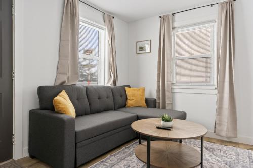 a living room with a couch and a table at Quaint Lakeview Getaway Trails & Town at Your Doorstep in Walker