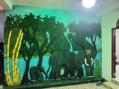 a mural of elephants on a wall in a room at Cinnamon garden villa in Weligama