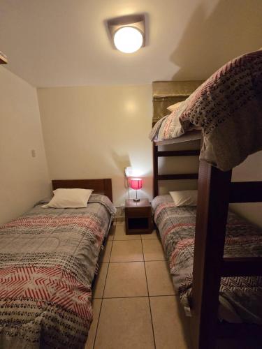 Ένα ή περισσότερα κρεβάτια σε δωμάτιο στο Amaru Peru Hotel