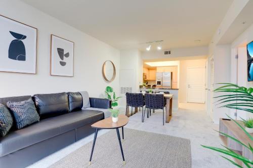 a living room with a couch and a table at Beautiful 1 Bedroom Apartment at Pentagon City in Arlington