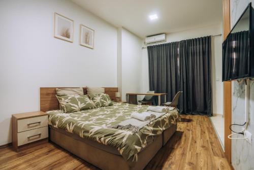 Ένα ή περισσότερα κρεβάτια σε δωμάτιο στο SANA Apartments