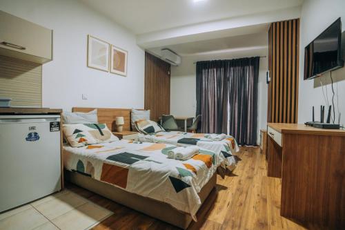 Ένα ή περισσότερα κρεβάτια σε δωμάτιο στο SANA Apartments