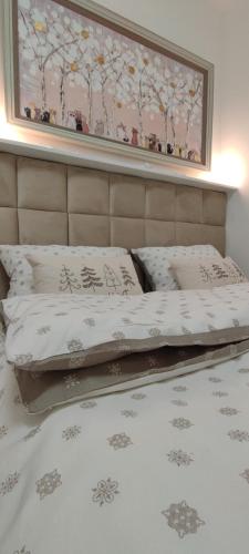 Ένα ή περισσότερα κρεβάτια σε δωμάτιο στο EMEM luxury apartment