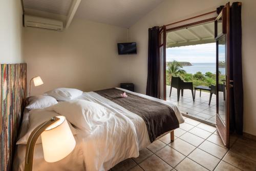 Postel nebo postele na pokoji v ubytování Le Rayon Vert - Hôtel & Restaurant VUE SUR MER
