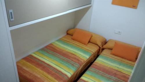 Postel nebo postele na pokoji v ubytování Apartamentos Baco Valles Pasiegos