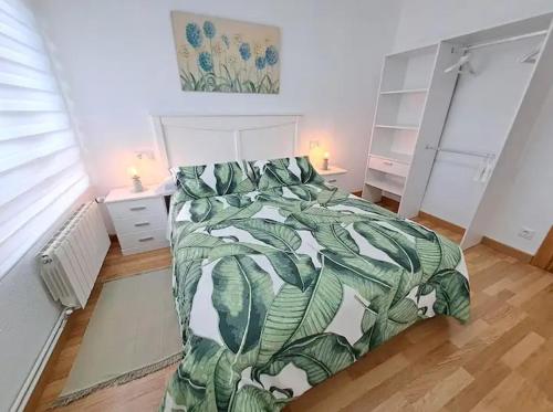 Postel nebo postele na pokoji v ubytování Apartamentos Baco Valles Pasiegos