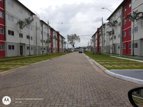 an empty street with red and white buildings at Apt Mário Covas COP 30 in Belém