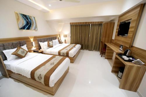 Postel nebo postele na pokoji v ubytování HOTEL ALFA EXECUTIVE