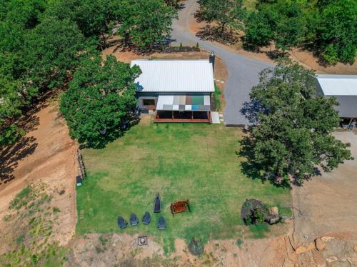 an aerial view of a house with a yard at Twisted Tree with Arkansas River Views and Hot Tub in Muskogee