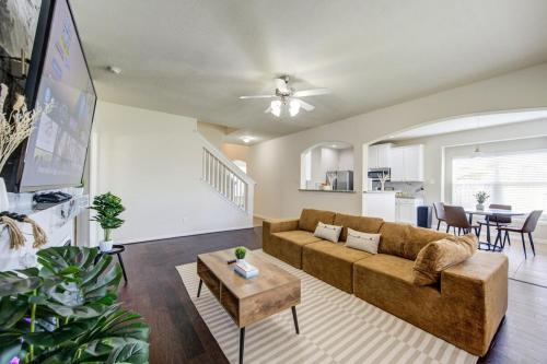 a living room with a couch and a table at Elegant Retreat at Katy Houston, 2330 sf, 4 Bedroom 2 and Half Baths, Game Room, King Bed, BBQ, Located near Katy Asian Town, Typhoon Waterpark in Katy
