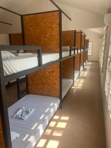 a row of bunk beds in a room at Hotel/Hostal Casa Blanca in Aquismón