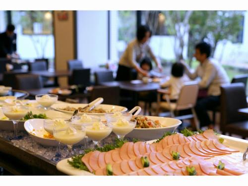 a buffet with many plates of food on a table at The Paradise Garden Sasebo - Vacation STAY 03127v in Sasebo