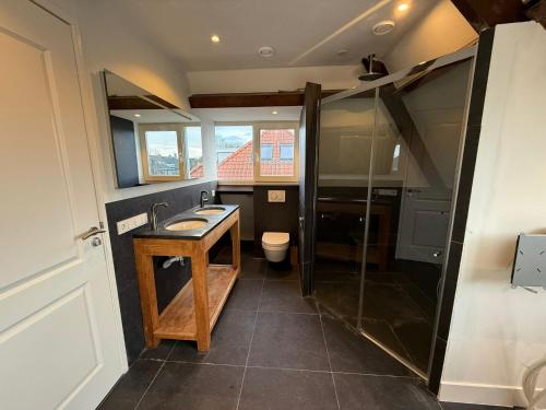 a bathroom with a sink and a shower at Stylish 1-Bedroom Apartment in Eindhoven in Eindhoven