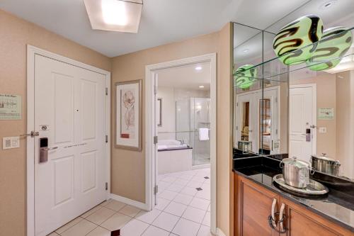 a kitchen with a sink and a bathroom at Luxury Studio MGM Signature Best Location Lazy River No Resort Fee in Las Vegas