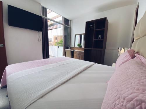 En eller flere senge i et værelse på Green House