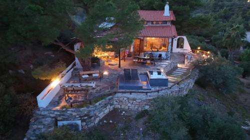 an aerial view of a house with a stone wall at Villa Haris in Sarti