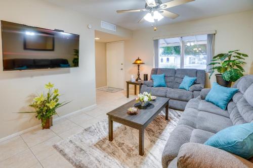 a living room with two couches and a table at Patio and Yard Sun City Home Near Casinos in Sun City