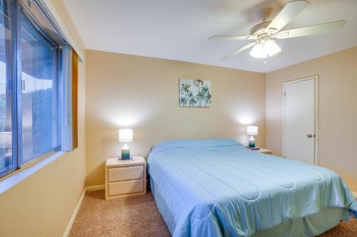 a bedroom with a blue bed and a window at Patio and Yard Sun City Home Near Casinos in Sun City