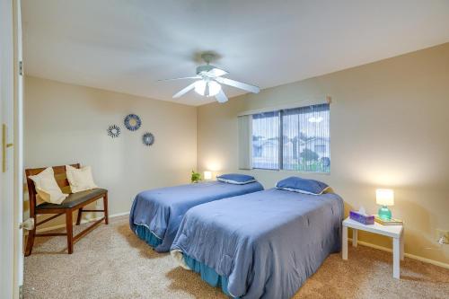 a bedroom with two beds and a ceiling fan at Patio and Yard Sun City Home Near Casinos in Sun City