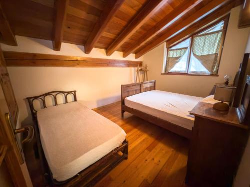 Ένα ή περισσότερα κρεβάτια σε δωμάτιο στο Casa Vacanze Grand-Haury da Andrea