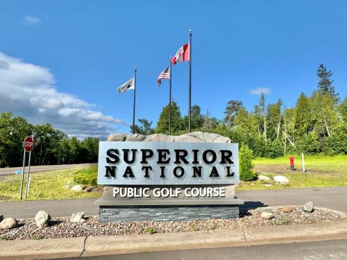 a sign for a superator national public golf course at Lutsen Mtn Ski in Ski out Gorgeous Views of Moose Mtn in Lutsen