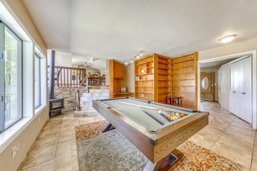 a living room with a pool table in it at Spacious Ruidoso Home with Patio and Mountain Views! in Ruidoso