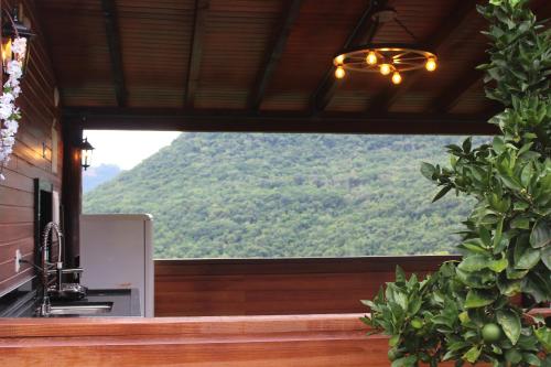 a view of a mountain from the kitchen of a house at Pousada Vila Felicita in São Valentim