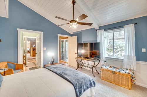 a bedroom with a bed and a ceiling fan at Knoxville Home On-Site Hiking and Outdoor Kitchen! in Knoxville
